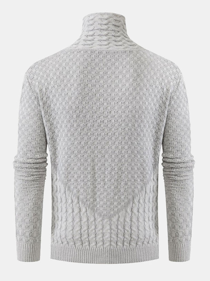 Guus | Gebreide jacquard coltrui met leren gespdetails