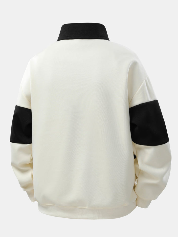 Hendrik | Polosweater met patchworkdetails en kleurvlakken en relaxte pasvorm