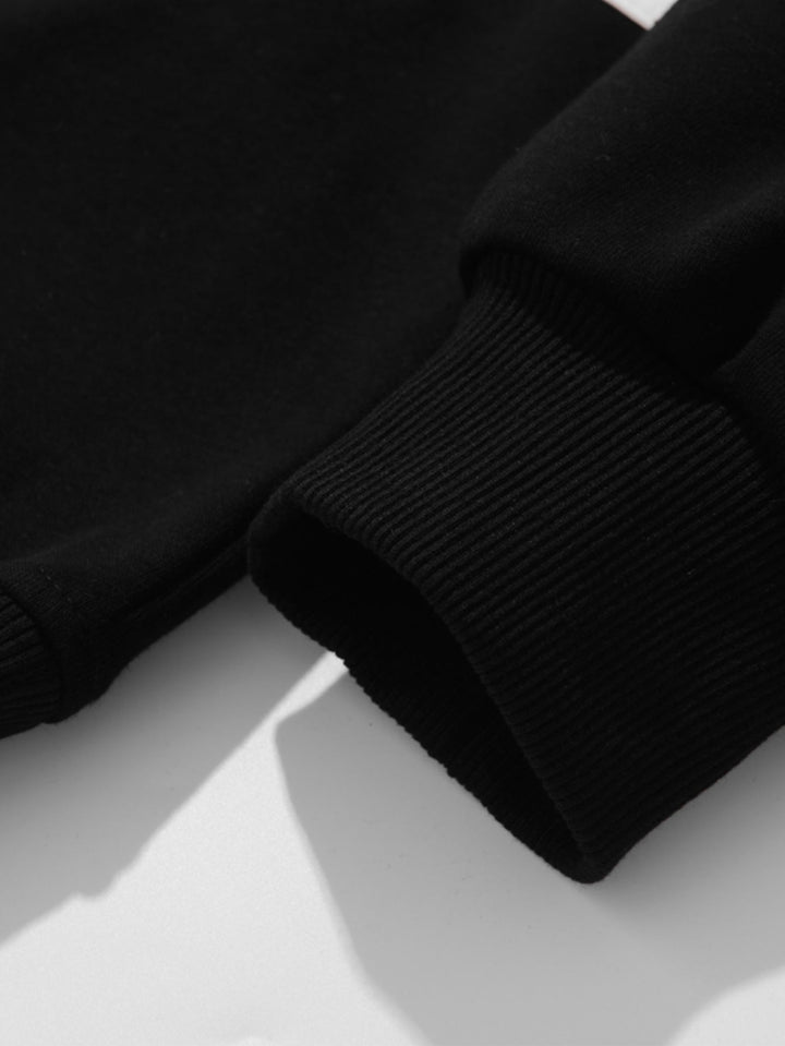 Hendrik | Polosweater met patchworkdetails en kleurvlakken en relaxte pasvorm