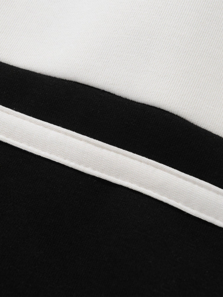 Hendrik | Polosweater met patchworkdetails en kleurvlakken en relaxte pasvorm