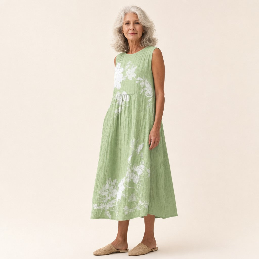 Karin | Mouwloze midi-jurk met witte bloemen op groen