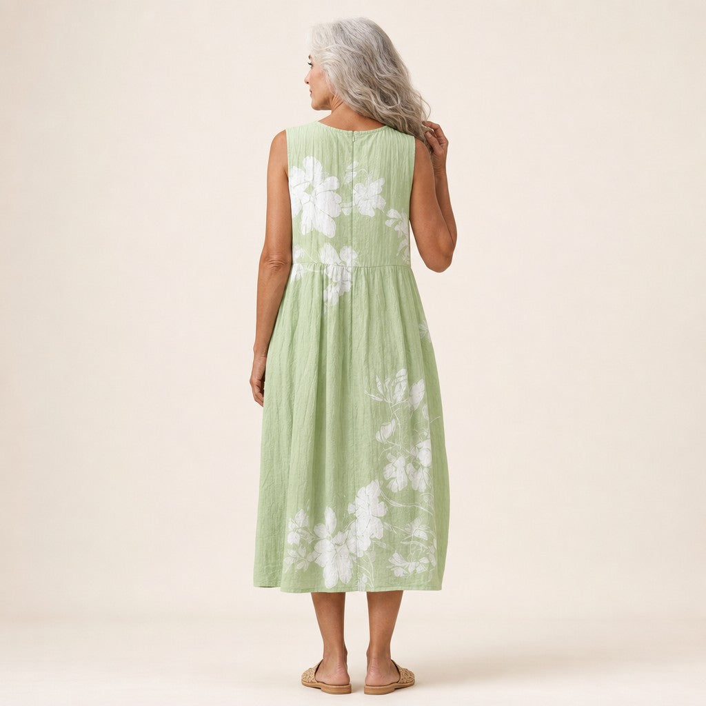 Karin | Mouwloze midi-jurk met witte bloemen op groen