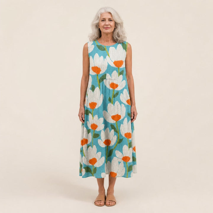 Ria | Mouwloze midi-jurk met bloemen op turquoise