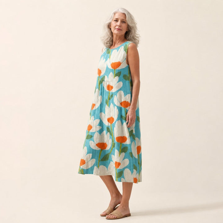 Ria | Mouwloze midi-jurk met bloemen op turquoise