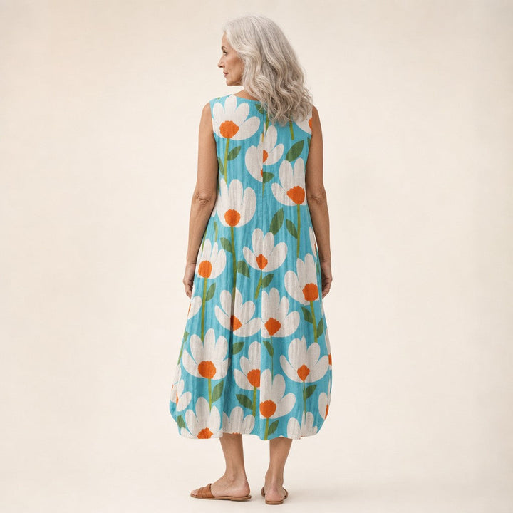 Ria | Mouwloze midi-jurk met bloemen op turquoise