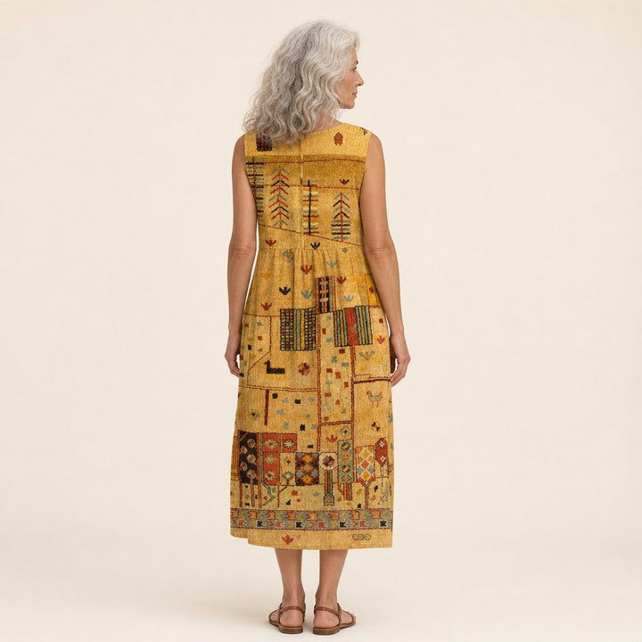 Nicole | Mouwloze midi-jurk met goudkleurig ornamentpatroon