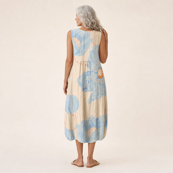 Renske | Mouwloze midi-jurk met grote blauwe bloemen