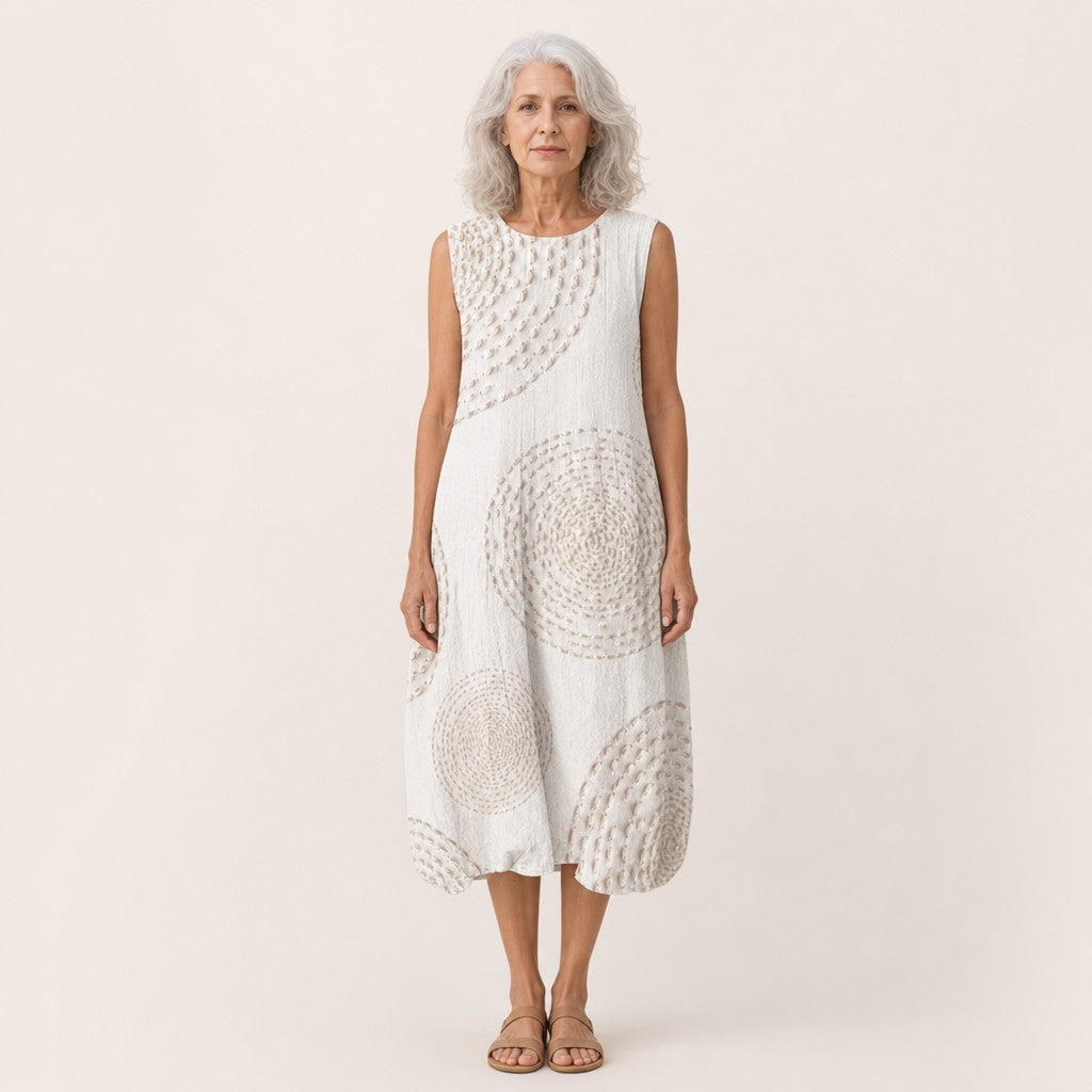 Monique | Mouwloze midi-jurk in wit met cirkelpatroon