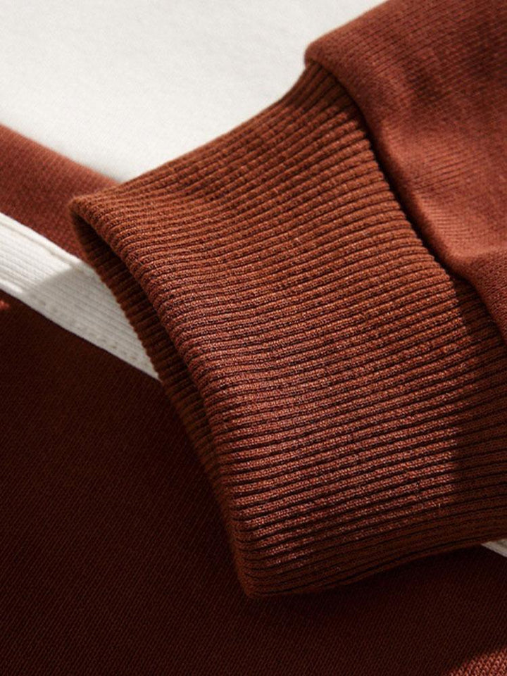 Jan | Polosweater met patchworkdetails en kleurvlakken en relaxte pasvorm