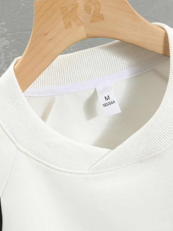 Remco | Oversized racesweater met tekstopdruk en kleurvlakken