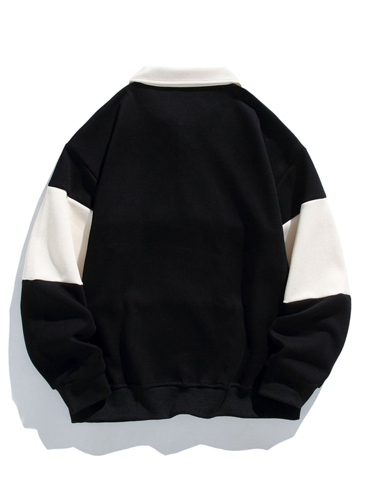 Jan | Polosweater met patchworkdetails en kleurvlakken en relaxte pasvorm