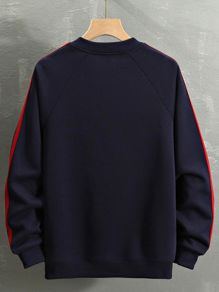 Remco | Oversized racesweater met tekstopdruk en kleurvlakken