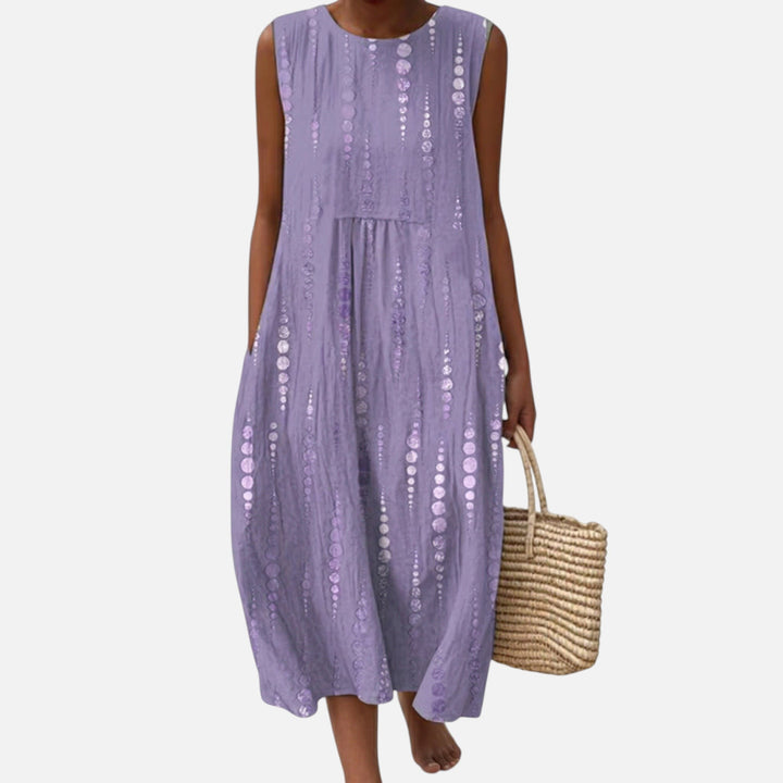 Esmee | Mouwloze midi-jurk in lila met stippenbanen