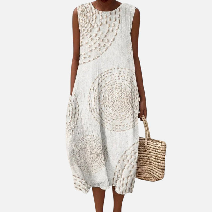 Monique | Mouwloze midi-jurk in wit met cirkelpatroon