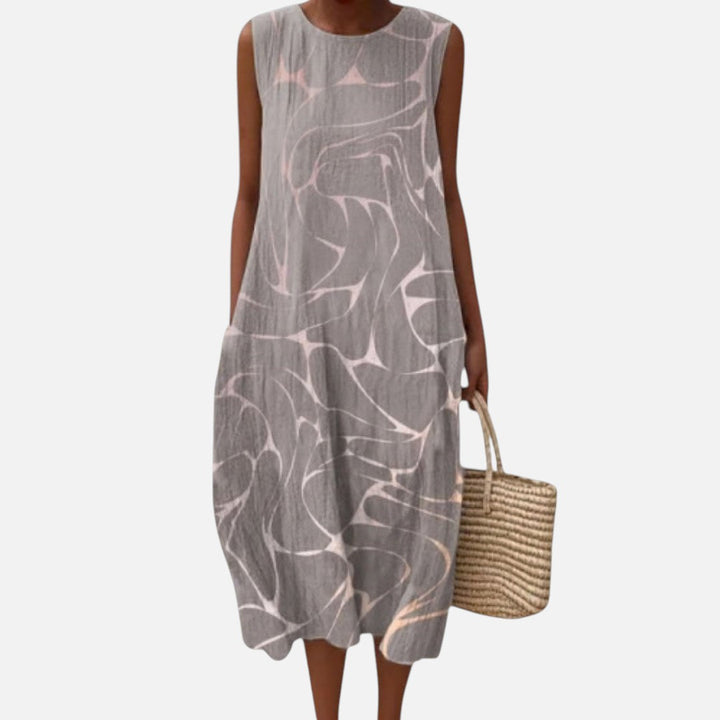 Margriet | Mouwloze midi-jurk met abstract vogelpatroon in grijs