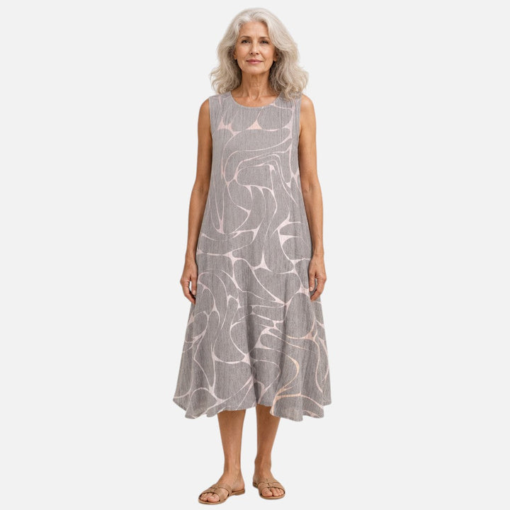 Margriet | Mouwloze midi-jurk met abstract vogelpatroon in grijs