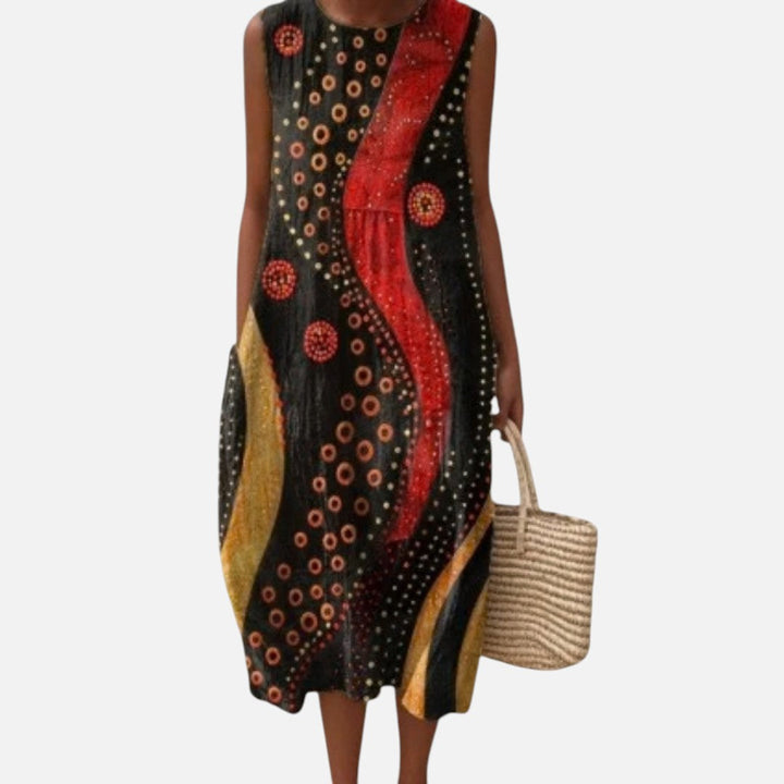 Lotte | Mouwloze midi-jurk met cirkels in rood en goud op zwart