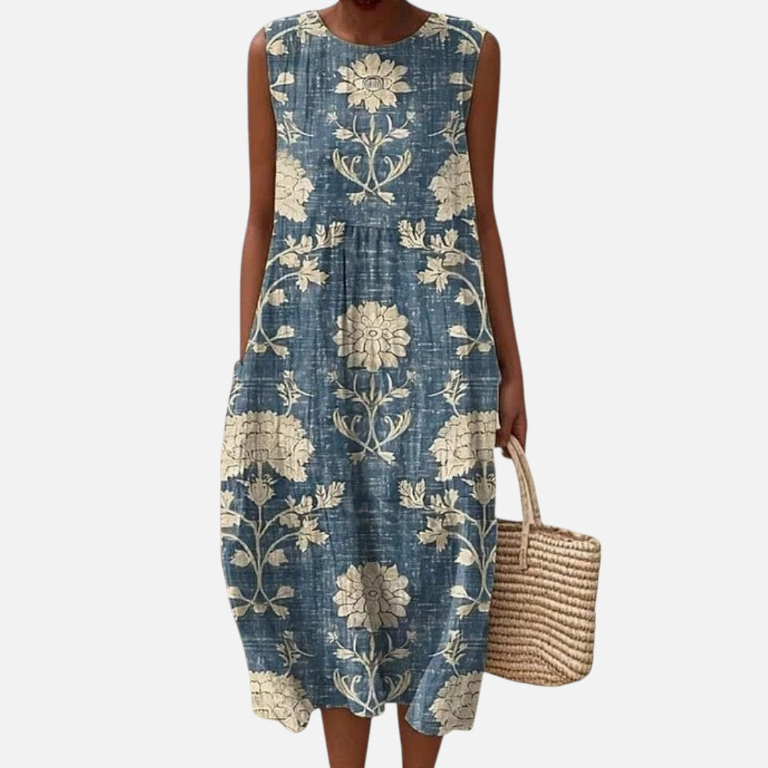 Lianne | Mouwloze midi-jurk met crèmekleurige bloemen op blauw