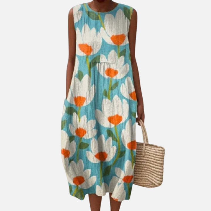 Ria | Mouwloze midi-jurk met bloemen op turquoise