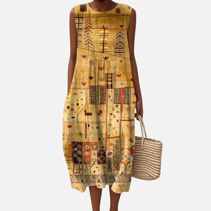 Nicole | Mouwloze midi-jurk met goudkleurig ornamentpatroon