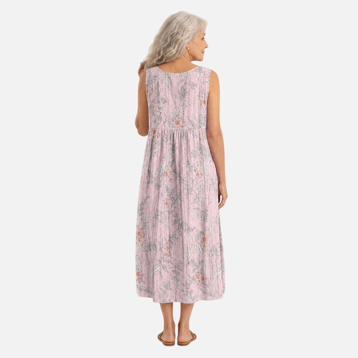 Feline | Mouwloze midi-jurk met grijze bloemtakken op roze