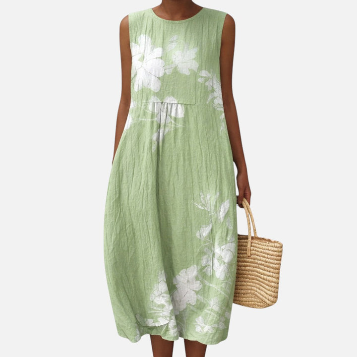 Karin | Mouwloze midi-jurk met witte bloemen op groen